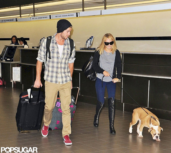 Liam Hemsworth and Miley Cyrus walked through LAX. Liam Hemsworth and Miley Cyrus walked through LAX.