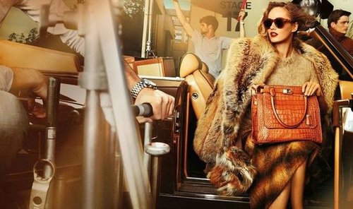 From large sunglasses to fur coats and croc purses, Michael Kors channels Hollywood glamour in his Fall '12 campaign featuring model Karmen Pedaru.
From large sunglasses to fur coats and croc purses, Michael Kors channels Hollywood glamour in his Fall '12 campaign featuring model Karmen Pedaru.