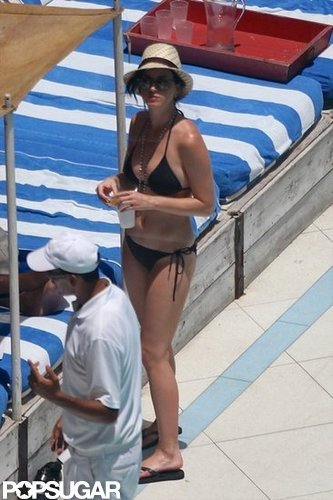 Katy Perry kept her hair covered under a straw fedora.
Katy Perry kept her hair covered under a straw fedora.