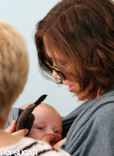 Maggie Gyllenhaal held baby Gloria.
Maggie Gyllenhaal held baby Gloria.