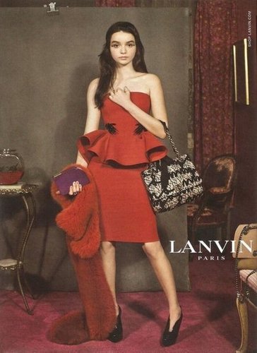 A stunning strapless red peplum dress steals the scene in the Lanvin Fall 2012 ad.
A stunning strapless red peplum dress steals the scene in the Lanvin Fall 2012 ad.