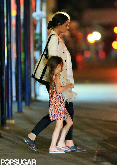 Katie Holmes held Suri's hand on their way into dinner at Nobu. Katie Holmes held Suri's hand on their way into dinner at Nobu.
