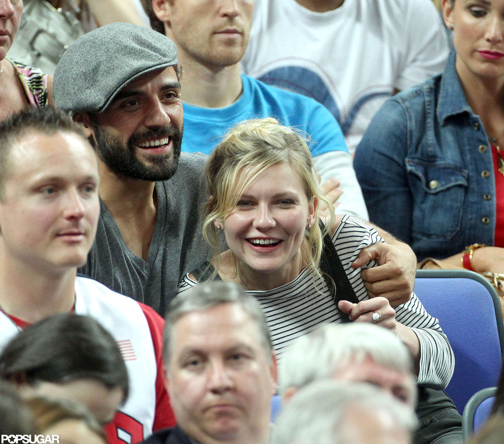 Kirsten Dunst and Oscar Issac both smiled while watching the Olympic basketball game.
Kirsten Dunst and Oscar Issac both smiled while watching the Olympic basketball game.