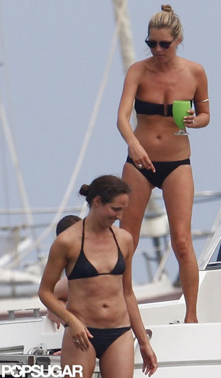 Kate Moss hung out with friends on a boat wearing a black bikini. Kate Moss hung out with friends on a boat wearing a black bikini.