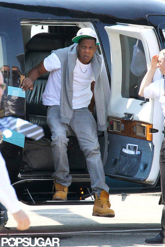 Jay-Z got out of a chopper.
Jay-Z got out of a chopper.