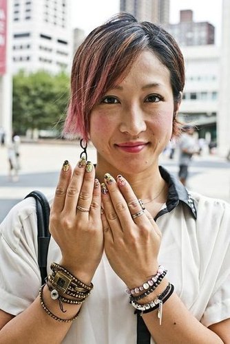 This woman's multicolored 3D nails, bright pink blush, and grown-out highlights made for a dynamic style.
Photo by Caroline Voagen Nelson
This woman's multicolored 3D nails, bright pink blush, and grown-out highlights made for a dynamic style.
Photo by Caroline Voagen Nelson
