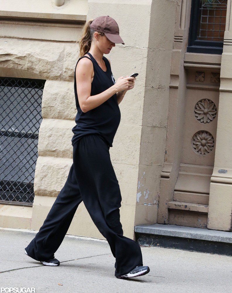 Gisele Bundchen let her baby bump show while walking home. Gisele Bundchen let her baby bump show while walking home.