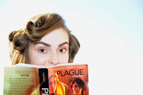 Backstage at the Nomia Spring 2013 show, a model read Michael Grant's Plague: A Gone Novel.
Backstage at the Nomia Spring 2013 show, a model read Michael Grant's Plague: A Gone Novel.