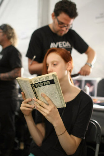 A model was snapped reading Sylvia Plath's The Bell Jar backstage at the Richard Chai — Love show during Spring 2013 Mercedes-Benz Fashion Week.
A model was snapped reading Sylvia Plath's The Bell Jar backstage at the Richard Chai — Love show during Spring 2013 Mercedes-Benz Fashion Week.