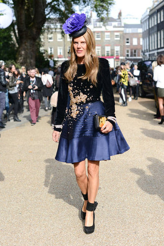 Anna Dello Russo stepped out in full regalia — with thick ankle-strap pumps and a purple fascinator completing her dramatic look.
Anna Dello Russo stepped out in full regalia — with thick ankle-strap pumps and a purple fascinator completing her dramatic look.