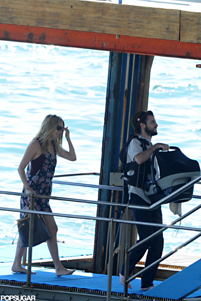 Tom Sturridge and Sienna Miller carried Marlowe Sturridge onto a boat in her carrier.
Tom Sturridge and Sienna Miller carried Marlowe Sturridge onto a boat in her carrier.