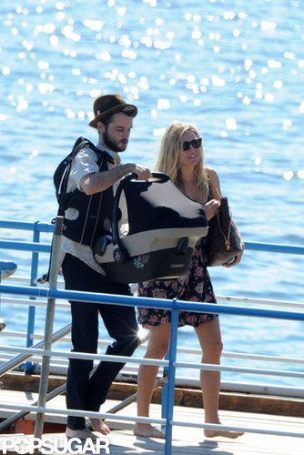 Tom Sturridge and Sienna Miller carried baby Marlowe off of a boat in her carrier.
Tom Sturridge and Sienna Miller carried baby Marlowe off of a boat in her carrier.