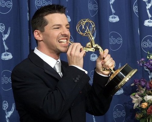 Sean Hayes chomped on his statue in 2000.
Sean Hayes chomped on his statue in 2000.
