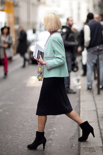 It's all about the play on striking proportions here — a cropped jacket, a knee-length skirt, and a boxy ankle-cut boot work well together.
It's all about the play on striking proportions here — a cropped jacket, a knee-length skirt, and a boxy ankle-cut boot work well together.
