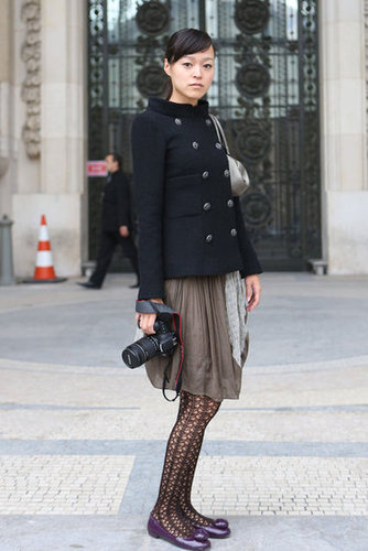 A structured peacoat tempered a breezy skirt and lacy tights.
A structured peacoat tempered a breezy skirt and lacy tights.