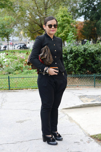 Black suiting got a modern update with a cropped jacket and an armful of bangles.
Black suiting got a modern update with a cropped jacket and an armful of bangles.