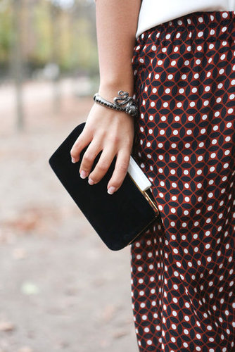 An artful balancing act — a minimalist clutch met printed pants.
An artful balancing act — a minimalist clutch met printed pants.