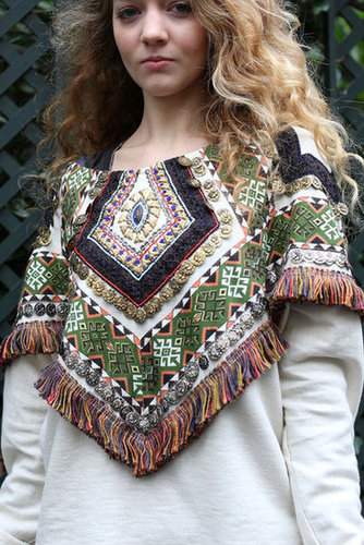 This embroidered capelet could shape even the most basic tops into a standout look with its bohemian embellishments.
This embroidered capelet could shape even the most basic tops into a standout look with its bohemian embellishments.