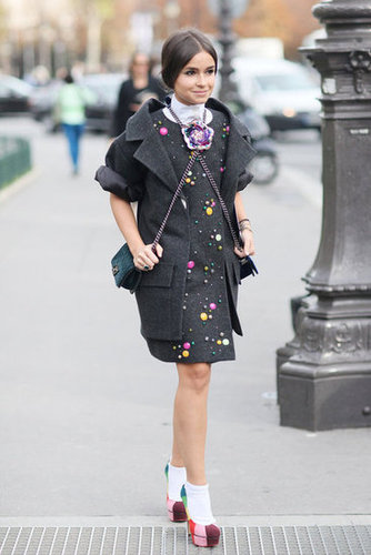 Miroslava Dumo kept her whimsical street charm coming in a Chanel ensemble and rainbow platform pumps.
Miroslava Dumo kept her whimsical street charm coming in a Chanel ensemble and rainbow platform pumps.