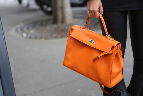 A classic satchel got a makeover in a shot of electric orange.
A classic satchel got a makeover in a shot of electric orange.