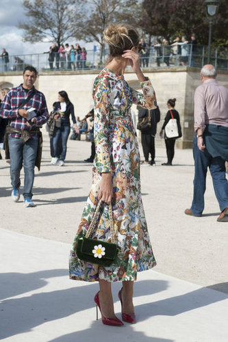 A sweet daisy-adorned bag echoes the pretty florals on her dress.
A sweet daisy-adorned bag echoes the pretty florals on her dress.
