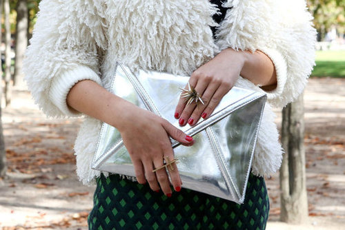 A metallic clutch was a stark contrast against a furry chubby.
A metallic clutch was a stark contrast against a furry chubby.