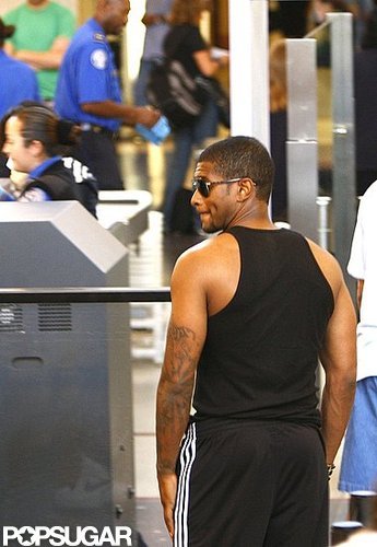 Usher stayed sexy while going through airport security in July 2009, showing off his arms in a tight black tank.
Usher stayed sexy while going through airport security in July 2009, showing off his arms in a tight black tank.
