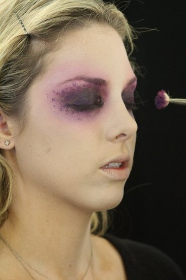 To create the purple flecks around the eyes, use highly pigmented gel eyeliners. Zizzo placed Chromaline ($20) in Process Magenta and Marine Ultra on the back of her hand, then used a distressed brush to dot on color. "Mess up a cheap brush — any old paintbrush you have knocking around will do," she says. "This way, the spots look more organic," she says.
To create the purple flecks around the eyes, use highly pigmented gel eyeliners. Zizzo placed Chromaline ($20) in Process Magenta and Marine Ultra on the back of her hand, then used a distressed brush to dot on color. "Mess up a cheap brush — any old paintbrush you have knocking around will do," she says. "This way, the spots look more organic," she says.