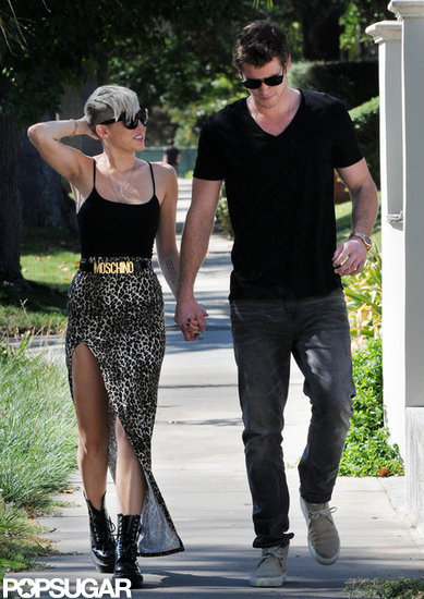 Miley Cyrus and Liam Hemsworth went for a stroll. Miley Cyrus and Liam Hemsworth went for a stroll.