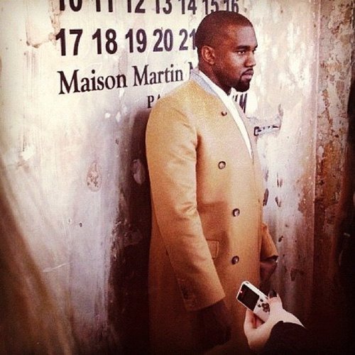Kanye West arrived in an overcoat from the Maison Martin Margiela x H&M collection to celebrate the line's launch.
Kanye West arrived in an overcoat from the Maison Martin Margiela x H&M collection to celebrate the line's launch.