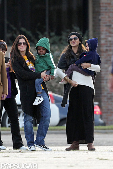 Sandra Bullock held Louis on her hip and hung out with Camila Alves, who held Vida. Sandra Bullock held Louis on her hip and hung out with Camila Alves, who held Vida.