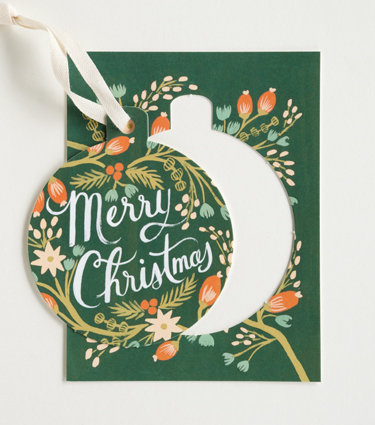 Thanks to a beautiful ornament cutout, the Rifle Paper Co. Pine Ornament Card ($18 for six) is a card and a gift in one.
Thanks to a beautiful ornament cutout, the Rifle Paper Co. Pine Ornament Card ($18 for six) is a card and a gift in one.
