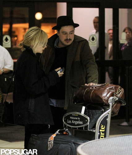 Carey Mulligan and husband Marcus Mumford arrived at LAX together.
Carey Mulligan and husband Marcus Mumford arrived at LAX together.