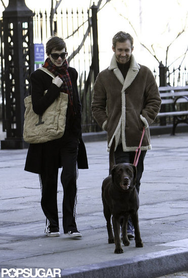Anne Hathaway and Adam Shulman smiled during a stroll with their dog. Anne Hathaway and Adam Shulman smiled during a stroll with their dog.