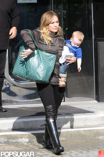 Hilary Duff walked out of a store in LA carrying Luca Comrie. Hilary Duff walked out of a store in LA carrying Luca Comrie.