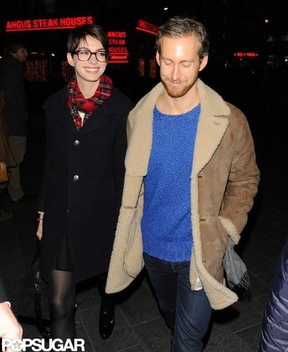 Anne Hathaway smiled at Adam Shulman.
Anne Hathaway smiled at Adam Shulman.