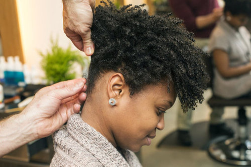Continue to twist and pin all around the head. Don't worry about parting hair perfectly. Just grab and go. All the twists should end near one central point at the crown of the head. In order to keep the twists smooth and flyaways scarce, use a pomade on your fingers as you style.
Continue to twist and pin all around the head. Don't worry about parting hair perfectly. Just grab and go. All the twists should end near one central point at the crown of the head. In order to keep the twists smooth and flyaways scarce, use a pomade on your fingers as you style.