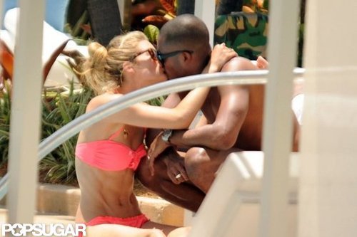 Supermodel Doutzen Kroes shared a kiss with husband Sunnery James during a June 2012 layover in Miami.
Supermodel Doutzen Kroes shared a kiss with husband Sunnery James during a June 2012 layover in Miami.
