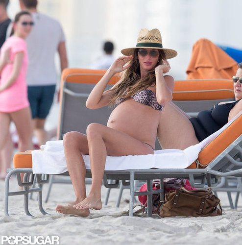 Gisele Bündchen showed off her baby bump on a Miami beach in November while vacationing with Tom Brady.
Gisele Bündchen showed off her baby bump on a Miami beach in November while vacationing with Tom Brady.