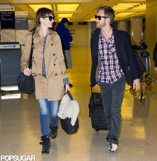 Anne Hathaway and Adam Shulman caught a flight out of JFK. Anne Hathaway and Adam Shulman caught a flight out of JFK.