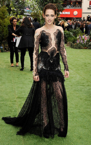 Kristen made a serious statement for the May premiere of Snow White and the Huntsman in London — she wore a gothic-inspired black lace Marchesa gown with a deceptively sheer bodice.
Kristen made a serious statement for the May premiere of Snow White and the Huntsman in London — she wore a gothic-inspired black lace Marchesa gown with a deceptively sheer bodice.