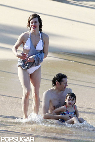 Bikini-Clad Milla Jovovich Poses Beachside With Her Family on NYE Bikini-Clad Milla Jovovich Poses Beachside With Her Family on NYE