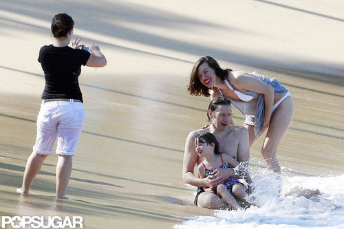 Bikini-Clad Milla Jovovich Poses Beachside With Her Family on NYE Bikini-Clad Milla Jovovich Poses Beachside With Her Family on NYE