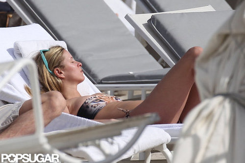 Nicky Hilton tanned herself on a chaise.
Nicky Hilton tanned herself on a chaise.