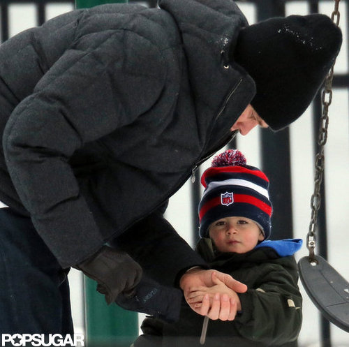 Tom Brady played with his sons on a swing set.
Tom Brady played with his sons on a swing set.