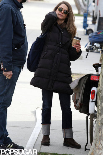 Keri Russell balanced a bag and coffee.
Keri Russell balanced a bag and coffee.