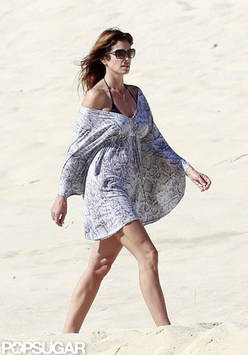 Cindy Crawford Covers Up For a Relaxing Beach Stroll Cindy Crawford Covers Up For a Relaxing Beach Stroll