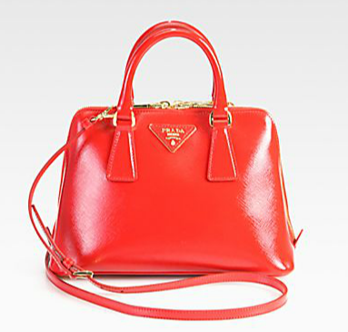 Prada's red Saffiano top handle bag ($1,395) screams retro from the second you set eyes on it. We adore the fiery red color and its structured silhouette.
Prada's red Saffiano top handle bag ($1,395) screams retro from the second you set eyes on it. We adore the fiery red color and its structured silhouette.