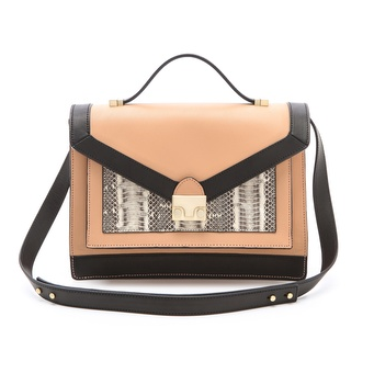 Loeffler Randall's Rider bag ($550) will lend major sophistication to any of your outfits. We approve of the colorblock detail, especially the snake print.
Loeffler Randall's Rider bag ($550) will lend major sophistication to any of your outfits. We approve of the colorblock detail, especially the snake print.
