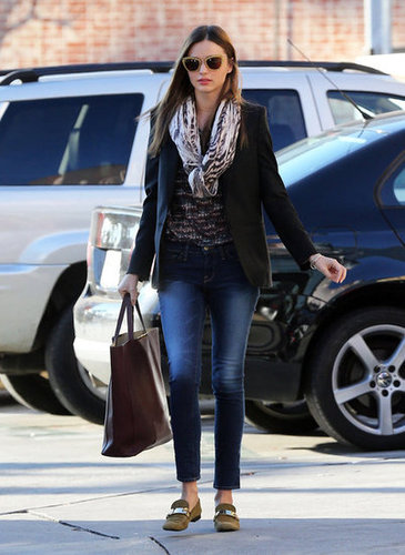 Miranda bundled up on a chilly LA day in a Stella McCartney blazer and tiger-print Mulberry scarf. She added a bit of schoolgirl cool with a pair of suede Céline loafers.
Miranda bundled up on a chilly LA day in a Stella McCartney blazer and tiger-print Mulberry scarf. She added a bit of schoolgirl cool with a pair of suede Céline loafers.
